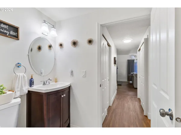 a spacious bathroom with a sink and a mirror