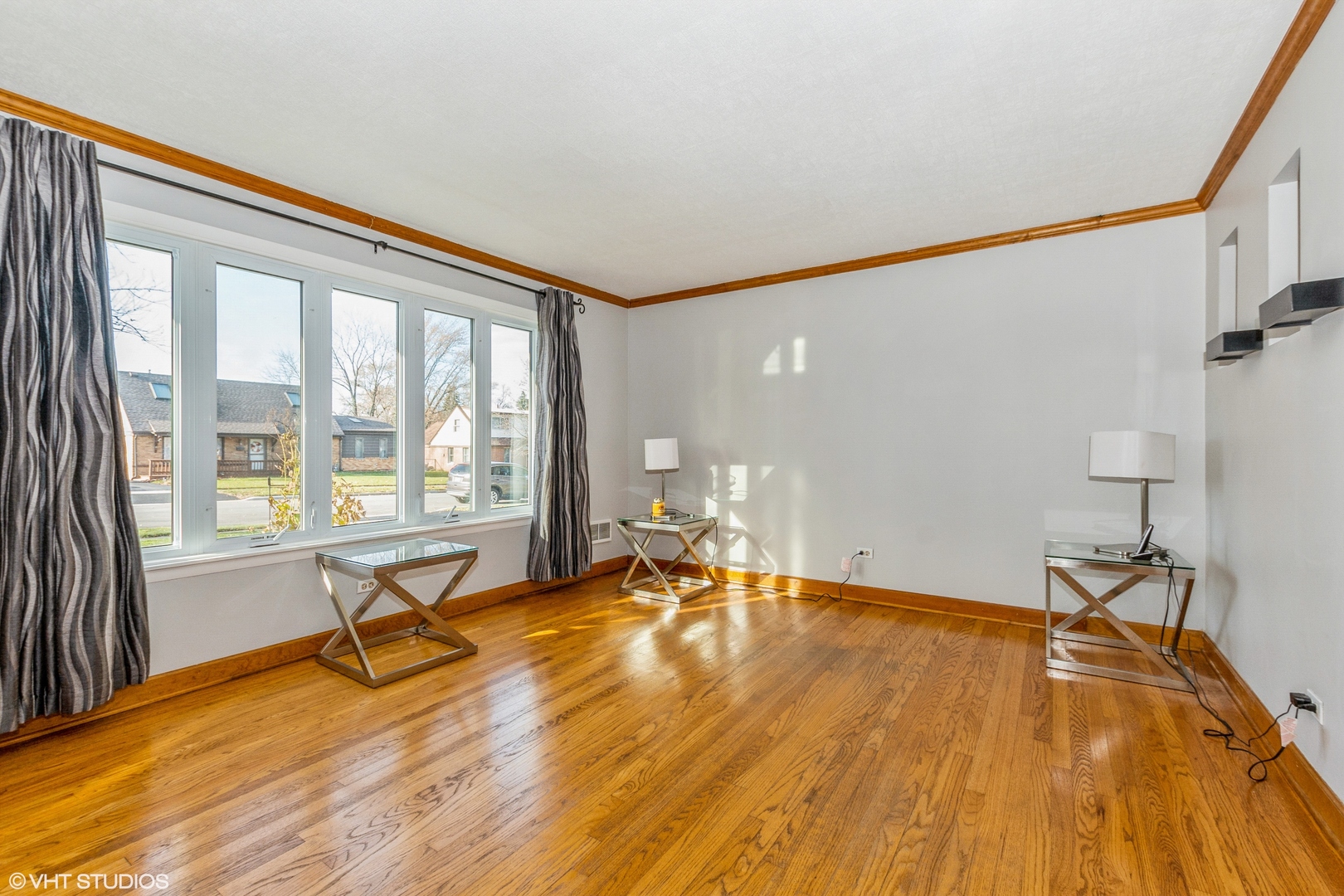 10749 Monitor Avenue Chicago Ridge, IL 60415 - Photo 2 of 11 a view of a livingroom with wooden floor and a rug