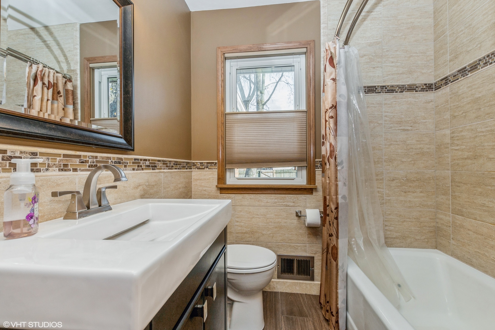 10749 Monitor Avenue Chicago Ridge, IL 60415 - Photo 6 of 11 a bathroom with a sink a toilet and shower
