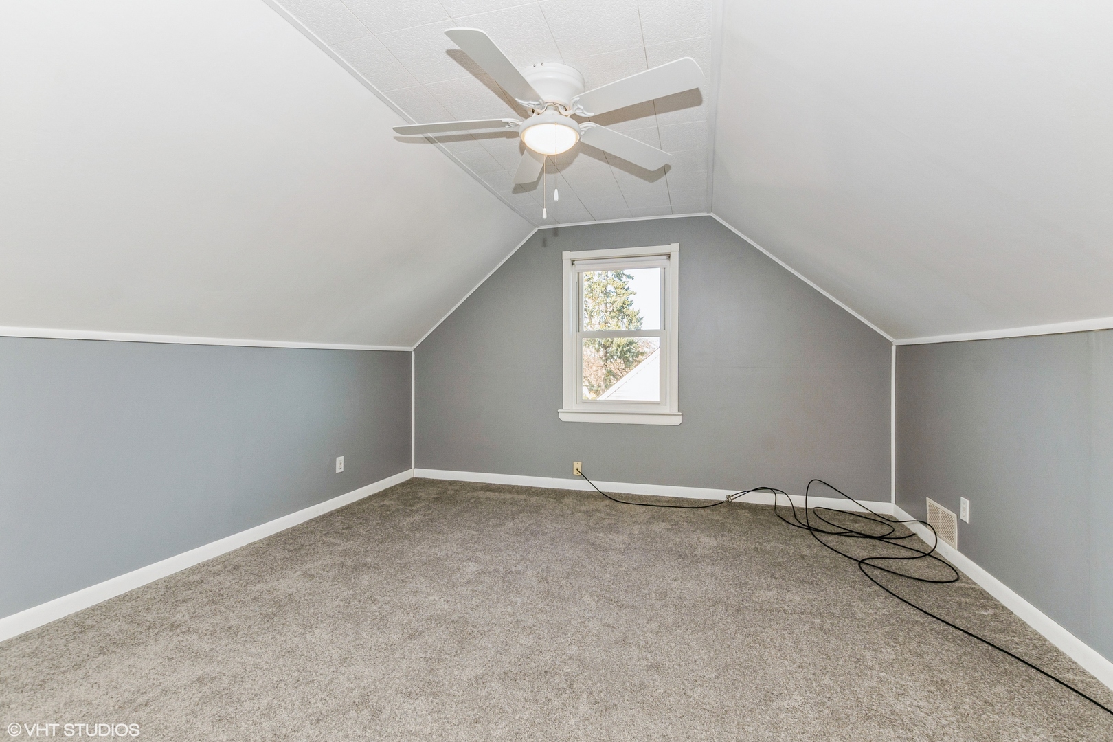 10749 Monitor Avenue Chicago Ridge, IL 60415 - Photo 8 of 11 an empty room with windows and ceiling fan