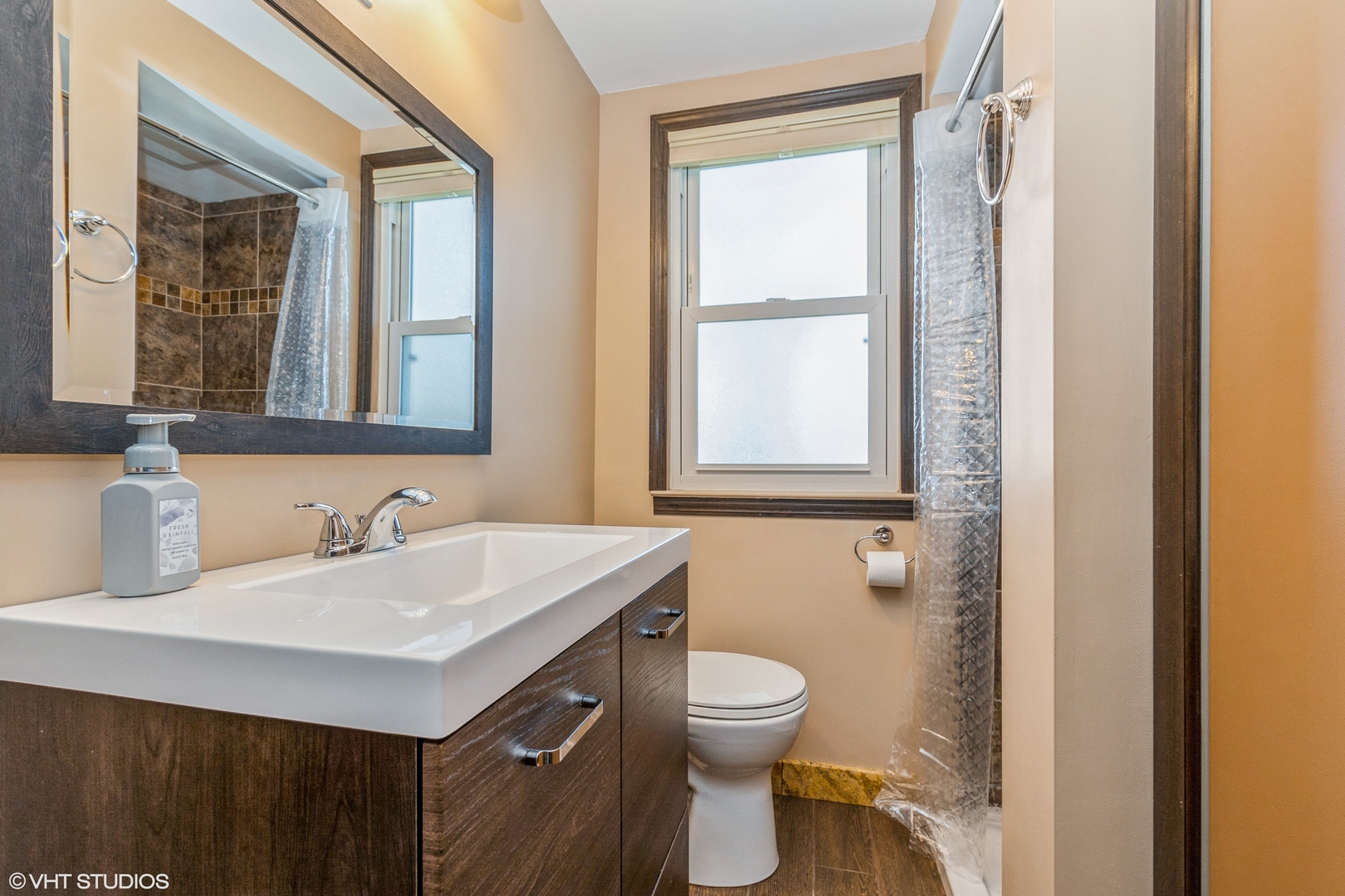 10749 Monitor Avenue Chicago Ridge, IL 60415 - Photo 9 of 11 a bathroom with a sink vanity and a toilet