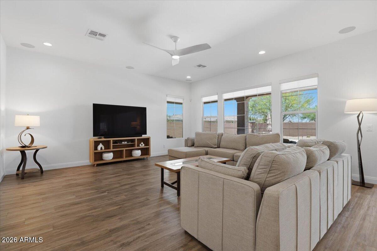 22608 East Stacey Road Queen Creek, AZ 85142 - Photo 20 of 83 a living room with furniture and a flat screen tv
