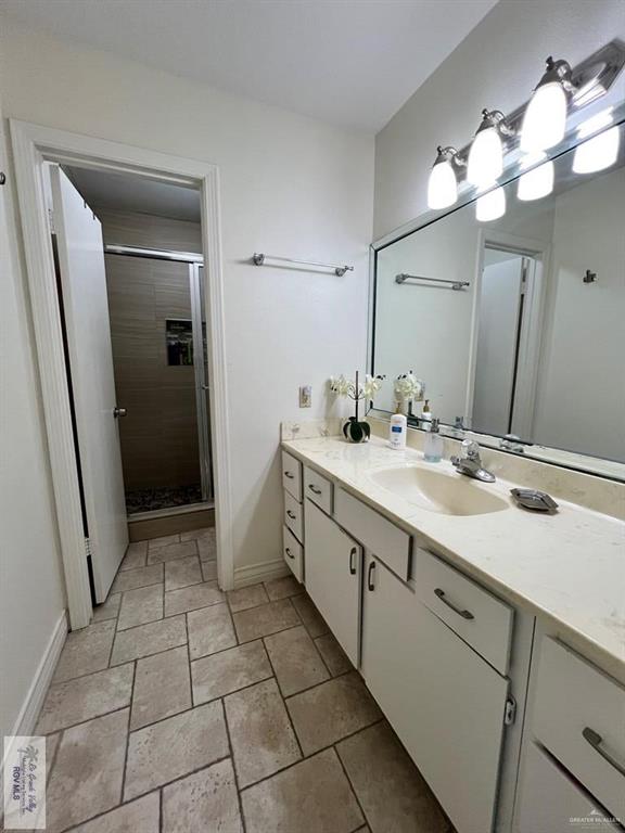 4601 Carmen Avenue Olmito, TX 78575 - Photo 20 of 45 a spacious bathroom with a double vanity sink a and mirror