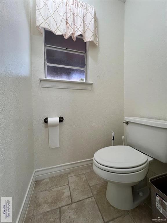 4601 Carmen Avenue Olmito, TX 78575 - Photo 23 of 45 a bathroom with a toilet and a sink