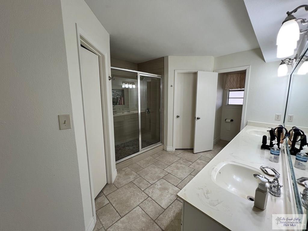4601 Carmen Avenue Olmito, TX 78575 - Photo 26 of 45 a bathroom with a sink and a mirror