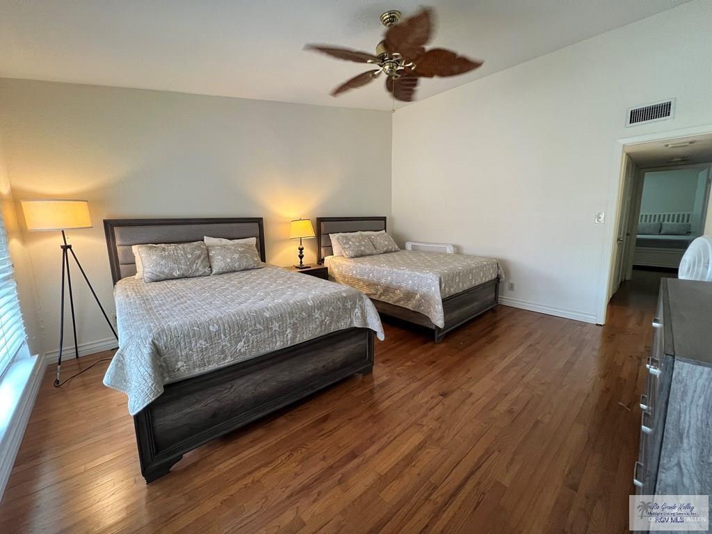 4601 Carmen Avenue Olmito, TX 78575 - Photo 27 of 45 a bedroom with two beds and wooden floor