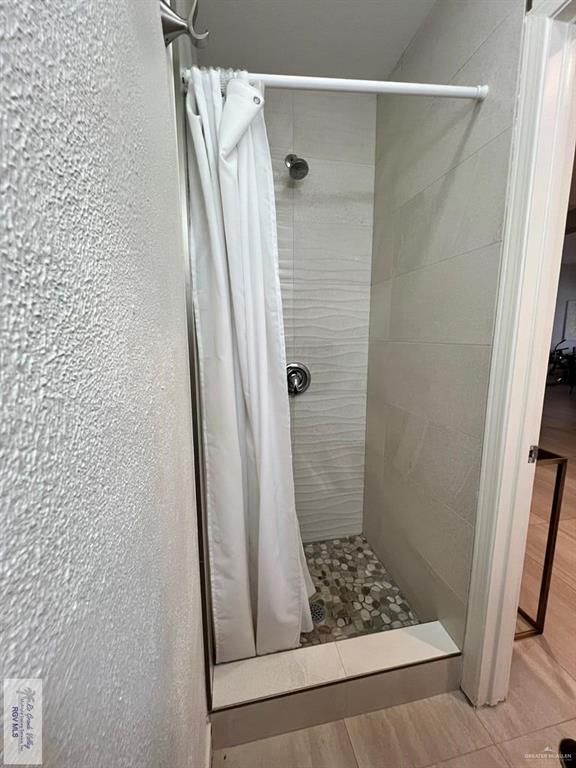 4601 Carmen Avenue Olmito, TX 78575 - Photo 29 of 45 a bathroom with a shower and a sink