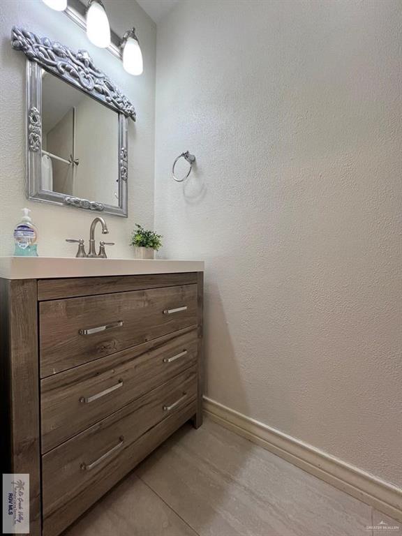 4601 Carmen Avenue Olmito, TX 78575 - Photo 30 of 45 a bathroom with a sink and a mirror