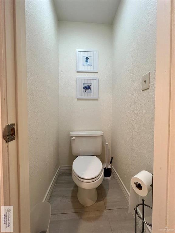 4601 Carmen Avenue Olmito, TX 78575 - Photo 31 of 45 a toilet sitting in a bathroom next to a sink