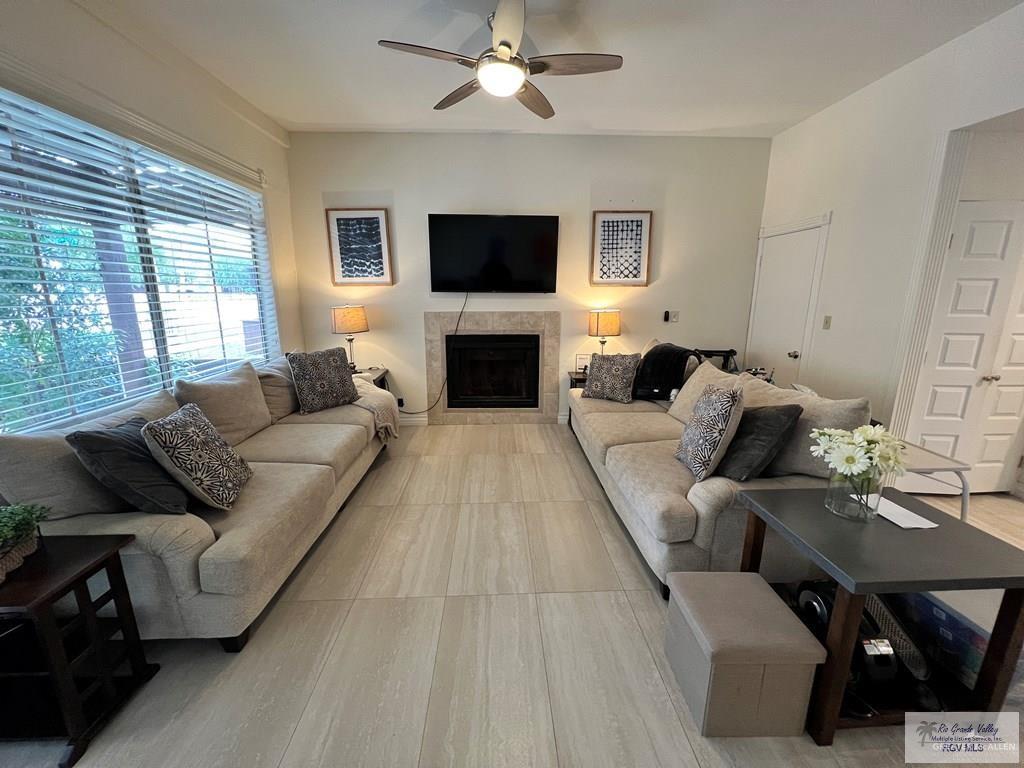4601 Carmen Avenue Olmito, TX 78575 - Photo 35 of 45 a living room with furniture flat screen tv and a fireplace