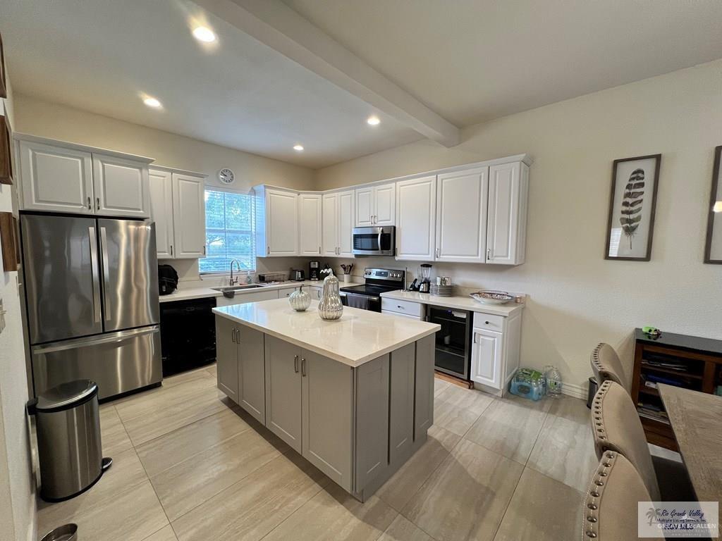 4601 Carmen Avenue Olmito, TX 78575 - Photo 42 of 45 a kitchen with a refrigerator a sink dishwasher and a refrigerator