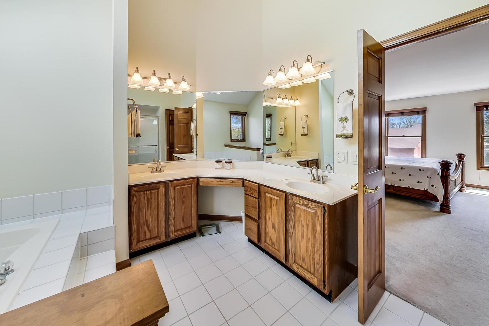 39898 North Harbor Ridge Drive Antioch, IL 60002 - Photo 14 of 27 a bathroom with a double vanity sink mirror and