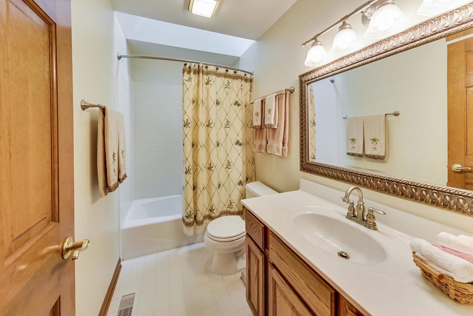 39898 North Harbor Ridge Drive Antioch, IL 60002 - Photo 18 of 27 a bathroom with a sink toilet and shower