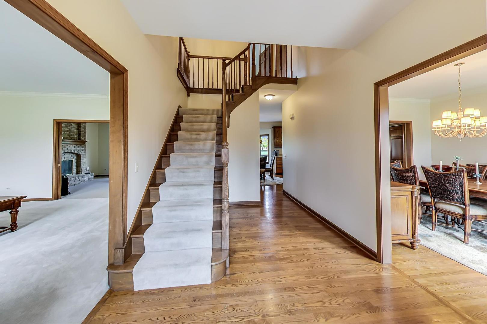 39898 North Harbor Ridge Drive Antioch, IL 60002 - Photo 2 of 27 a view of entryway and hall with wooden floor