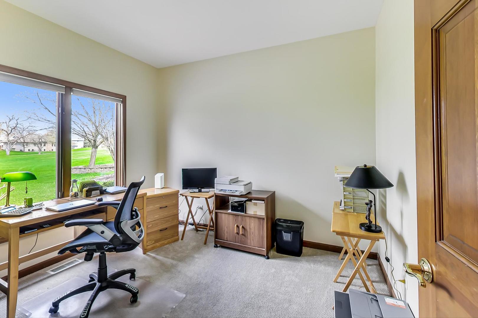 39898 North Harbor Ridge Drive Antioch, IL 60002 - Photo 9 of 27 a view of a workspace with furniture and a window