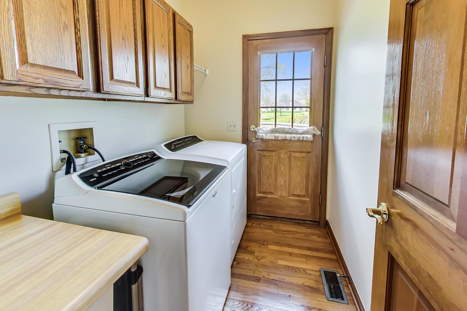 39898 North Harbor Ridge Drive Antioch, IL 60002 - Photo 10 of 27 a kitchen with a stove sink and cabinets