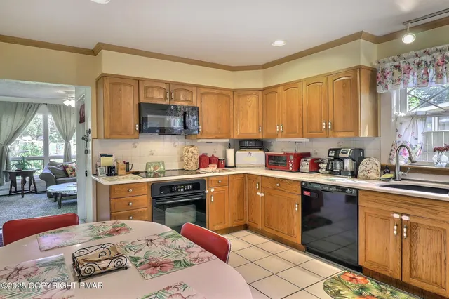 a view of an entryway and livingroom