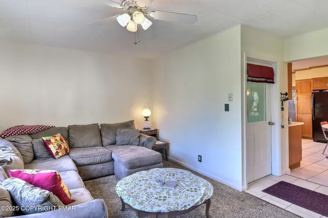 a room with furniture and flat screen tv
