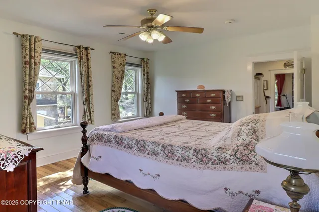 a bedroom with a bed and a tv