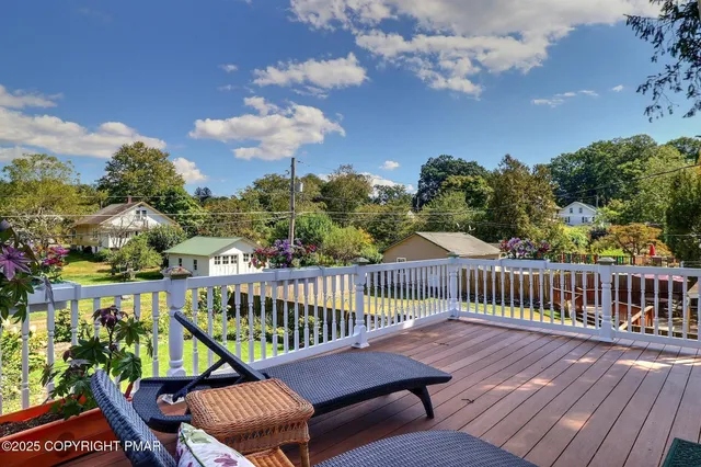 a bathroom with a sink a toilet and a window
