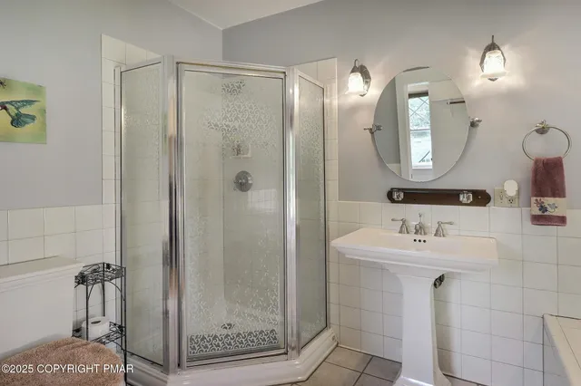 a view of entryway livingroom and hall with wooden floor