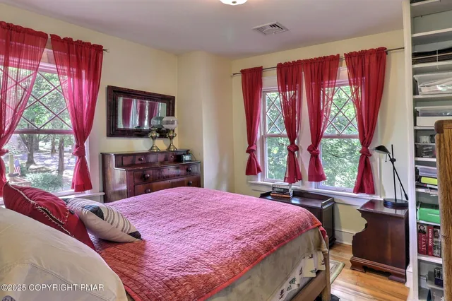a living room with furniture a window and gym equipment