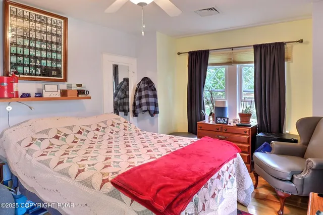 a living room with stainless steel appliances granite countertop furniture and a fireplace