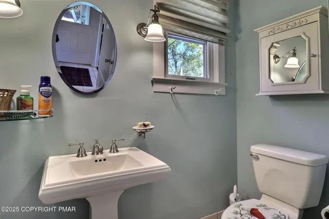 a view of a chair and table in backyard