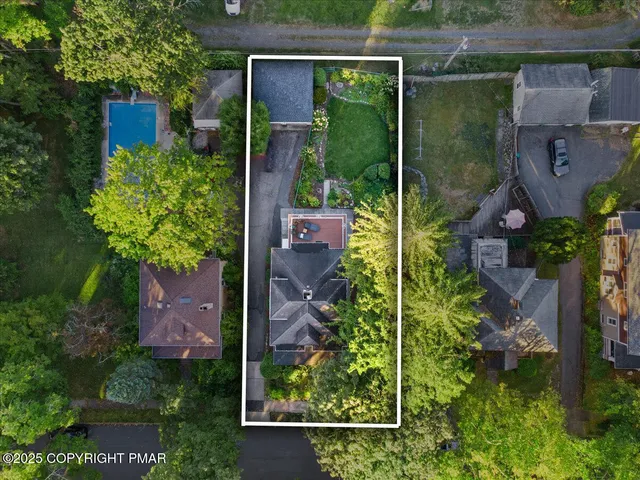 a living room with furniture a rug and a large window