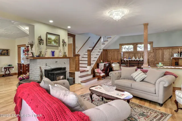 a view of a dining room with furniture and chandelier