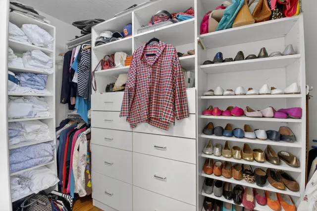 a living room with furniture a fireplace and walls