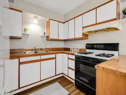 a kitchen with a stove and a sink