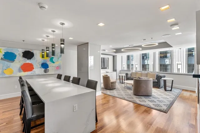 a living room with dining room and furniture