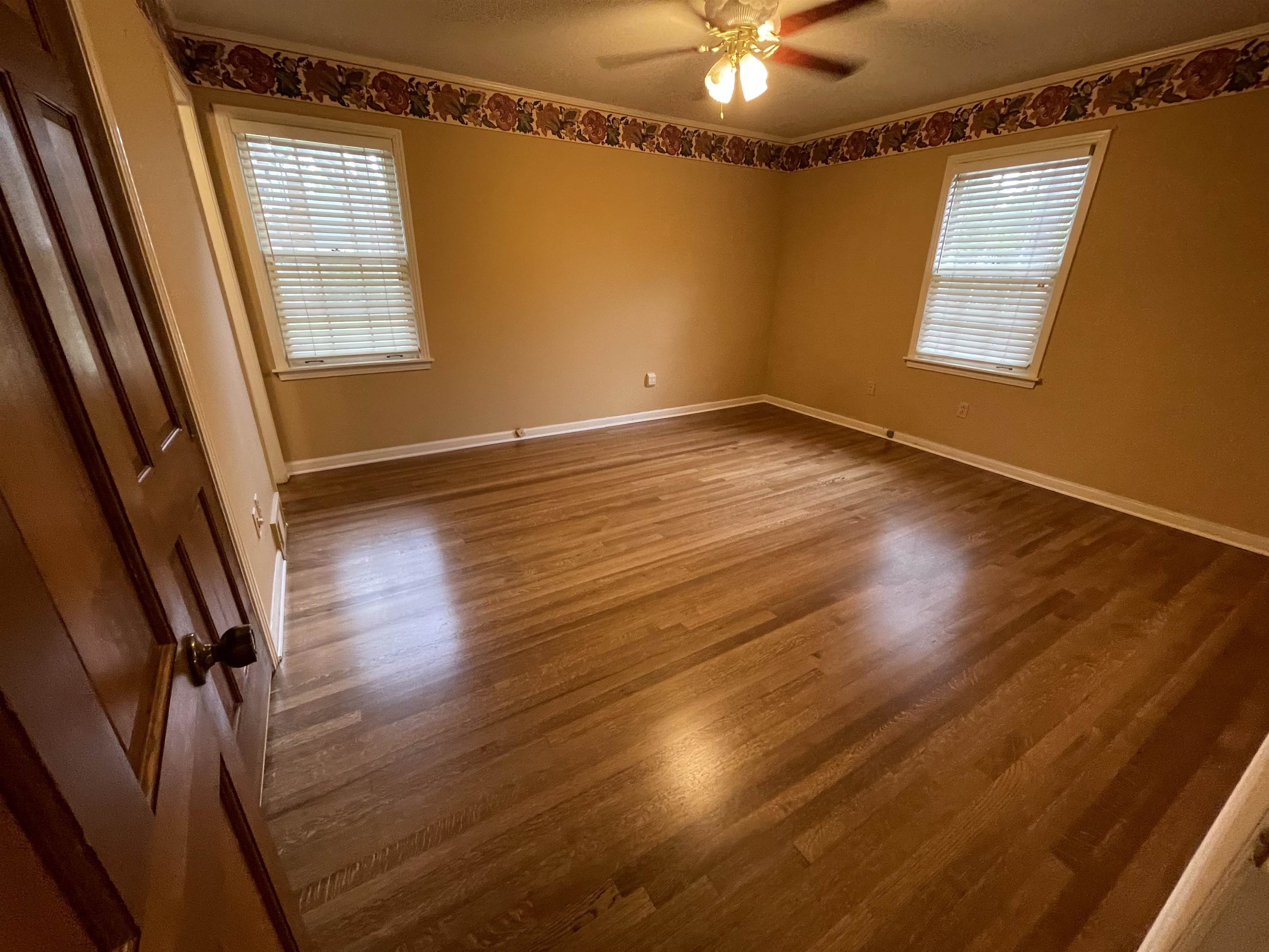 379 McElroy Road Memphis, TN 38120 - Photo 15 of 19 Spare room featuring wood finished floors and healthy amount of natural light