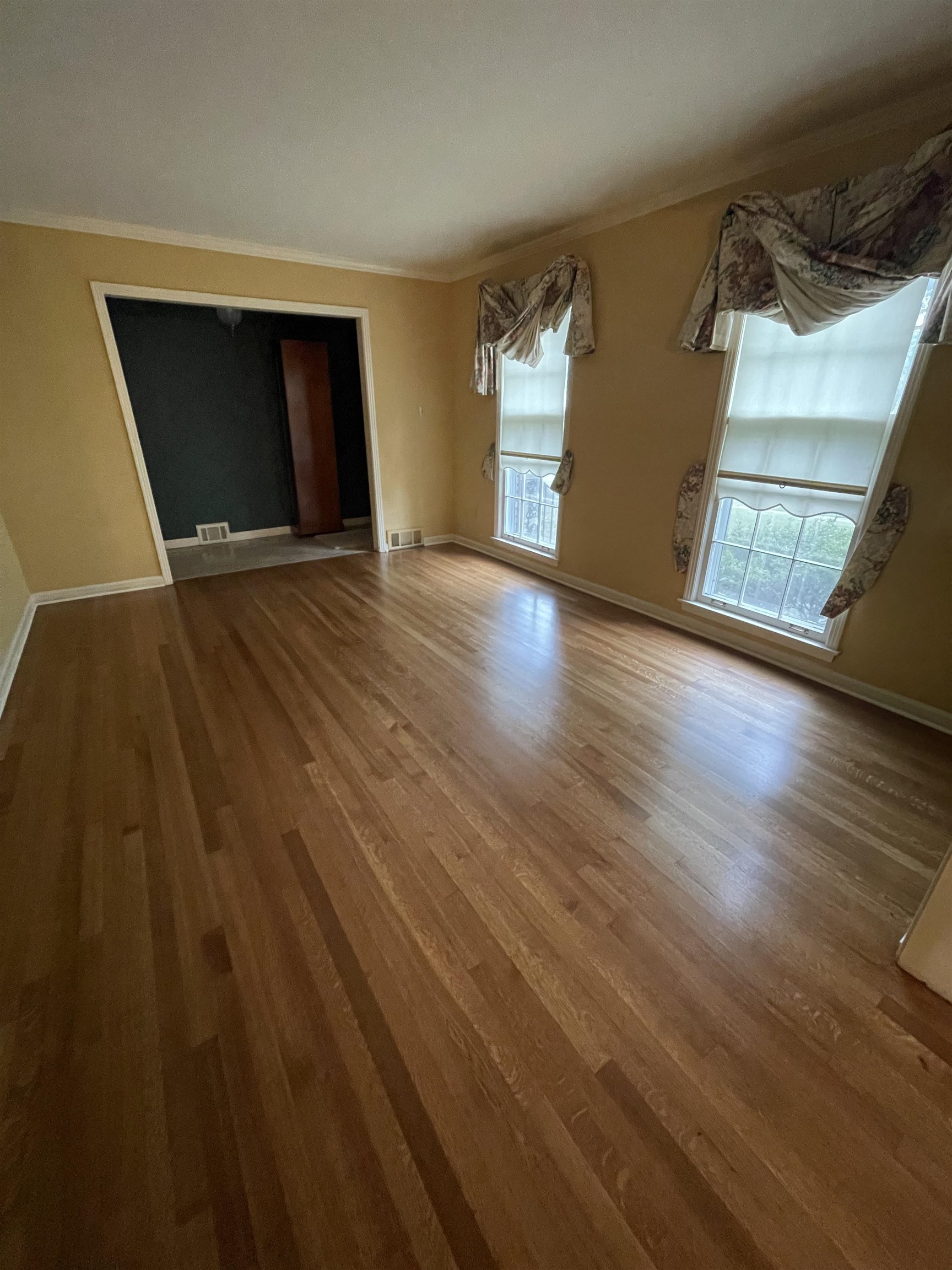 379 McElroy Road Memphis, TN 38120 - Photo 6 of 19 Unfurnished room with crown molding and wood finished floors