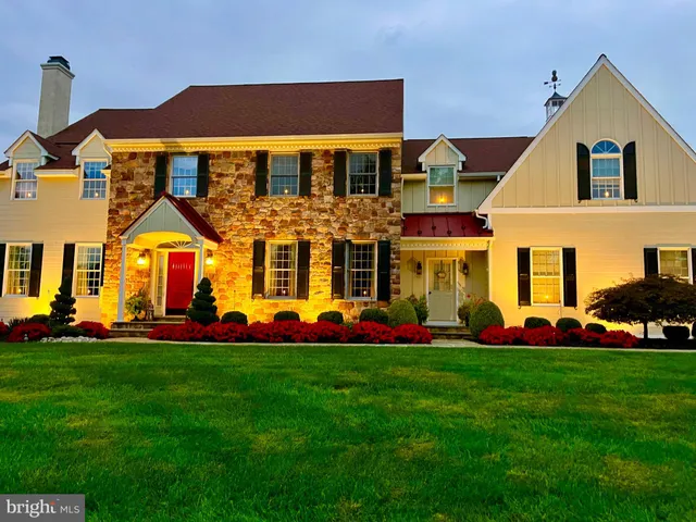 a front view of building with yard