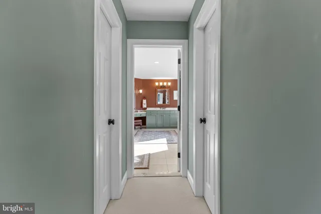 a dining room with a wooden table and chairs