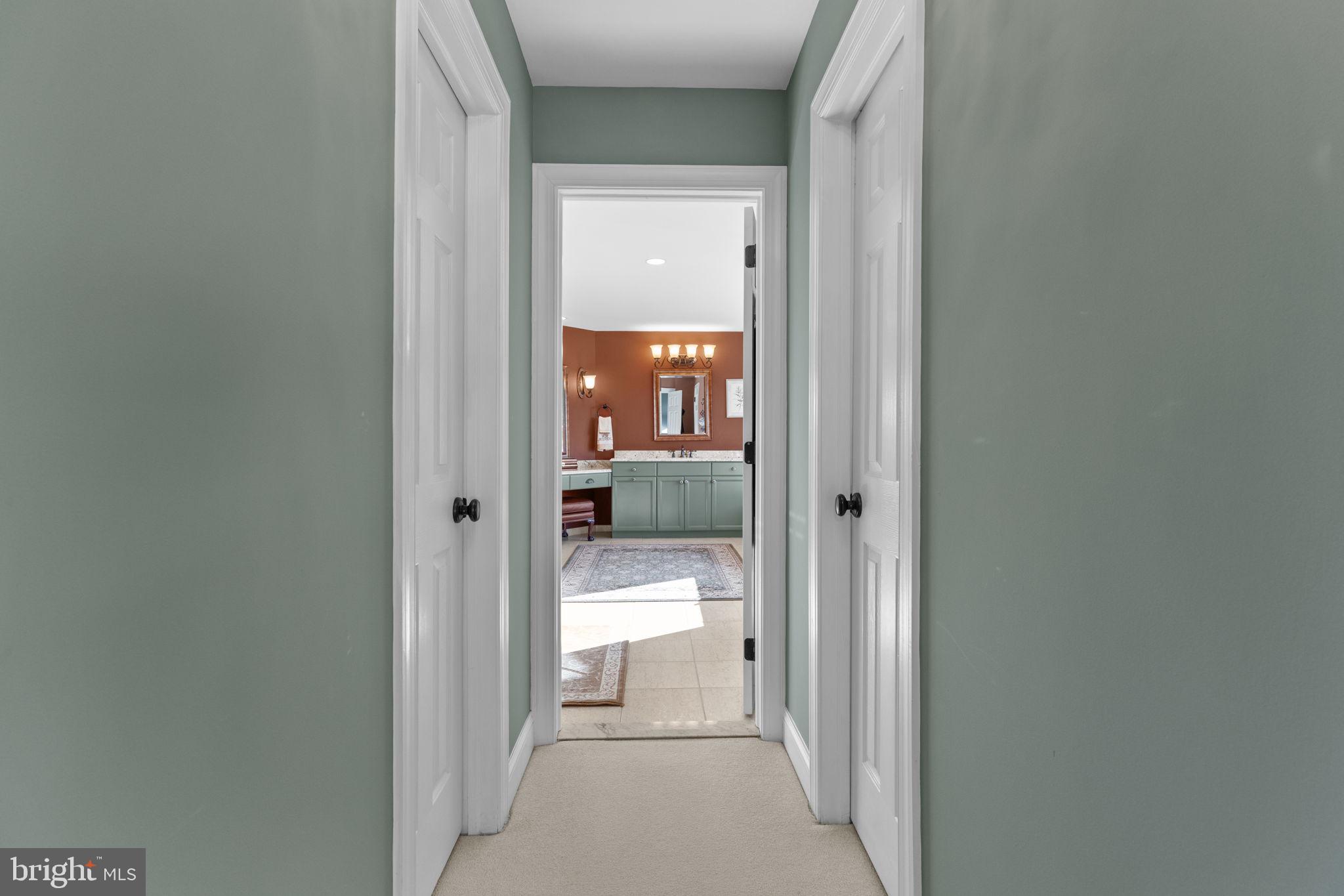 1100 Pineville Road New Hope, PA 18938 - Photo 33 of 97 a view of a hallway with wooden floor and a bathroom