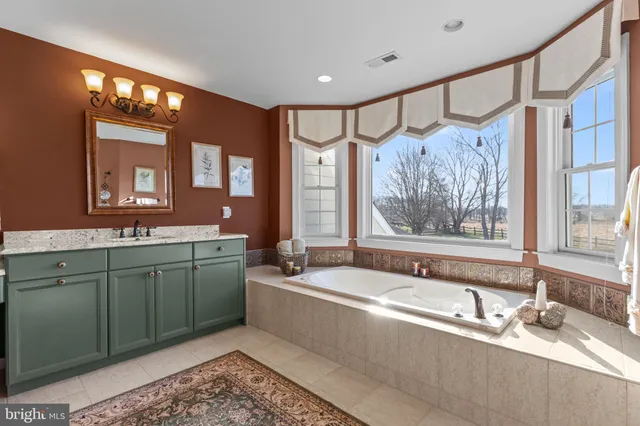 a room with a wooden floor and cabinets