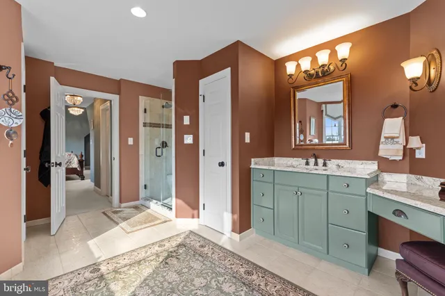 a bathroom with a toilet a sink and glass door