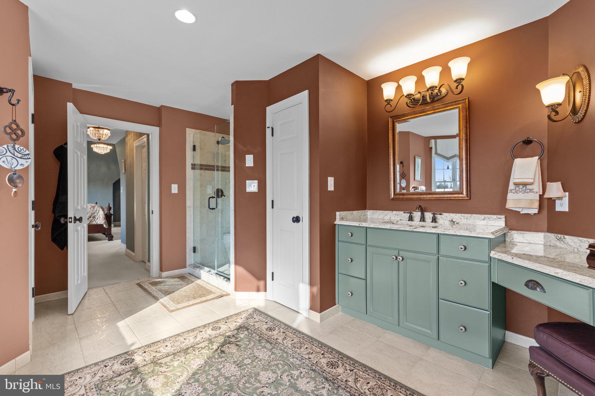 1100 Pineville Road New Hope, PA 18938 - Photo 38 of 97 a spacious bathroom with a granite countertop sink mirror and a