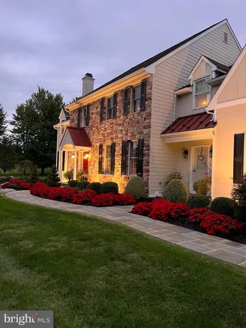 a front view of a house with a big yard