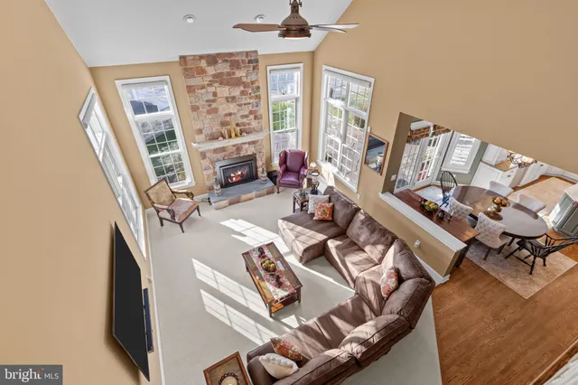 a view of a swimming pool with lawn chairs under an umbrella