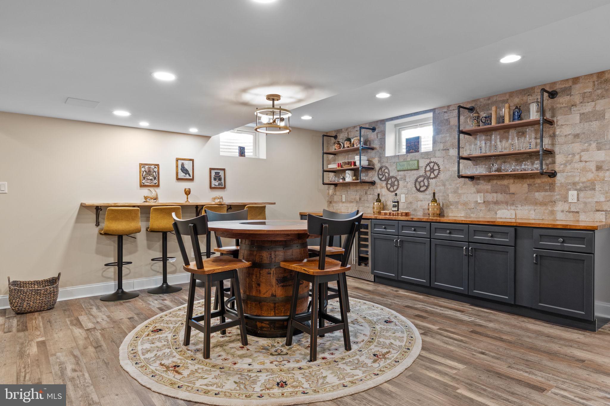 1100 Pineville Road New Hope, PA 18938 - Photo 52 of 97 a dining room with a wooden table and chairs