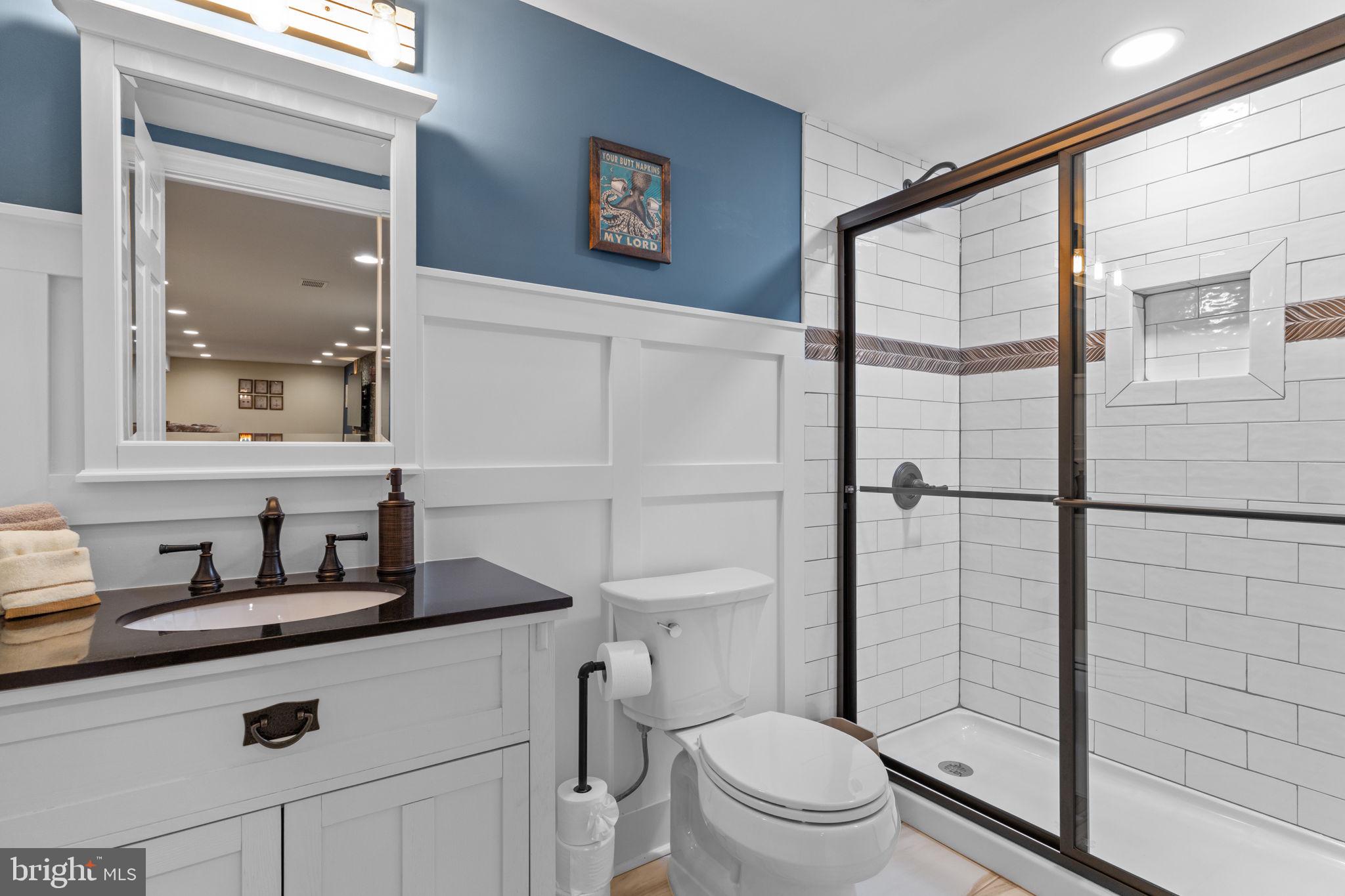 1100 Pineville Road New Hope, PA 18938 - Photo 58 of 97 a bathroom with a toilet a sink and glass door