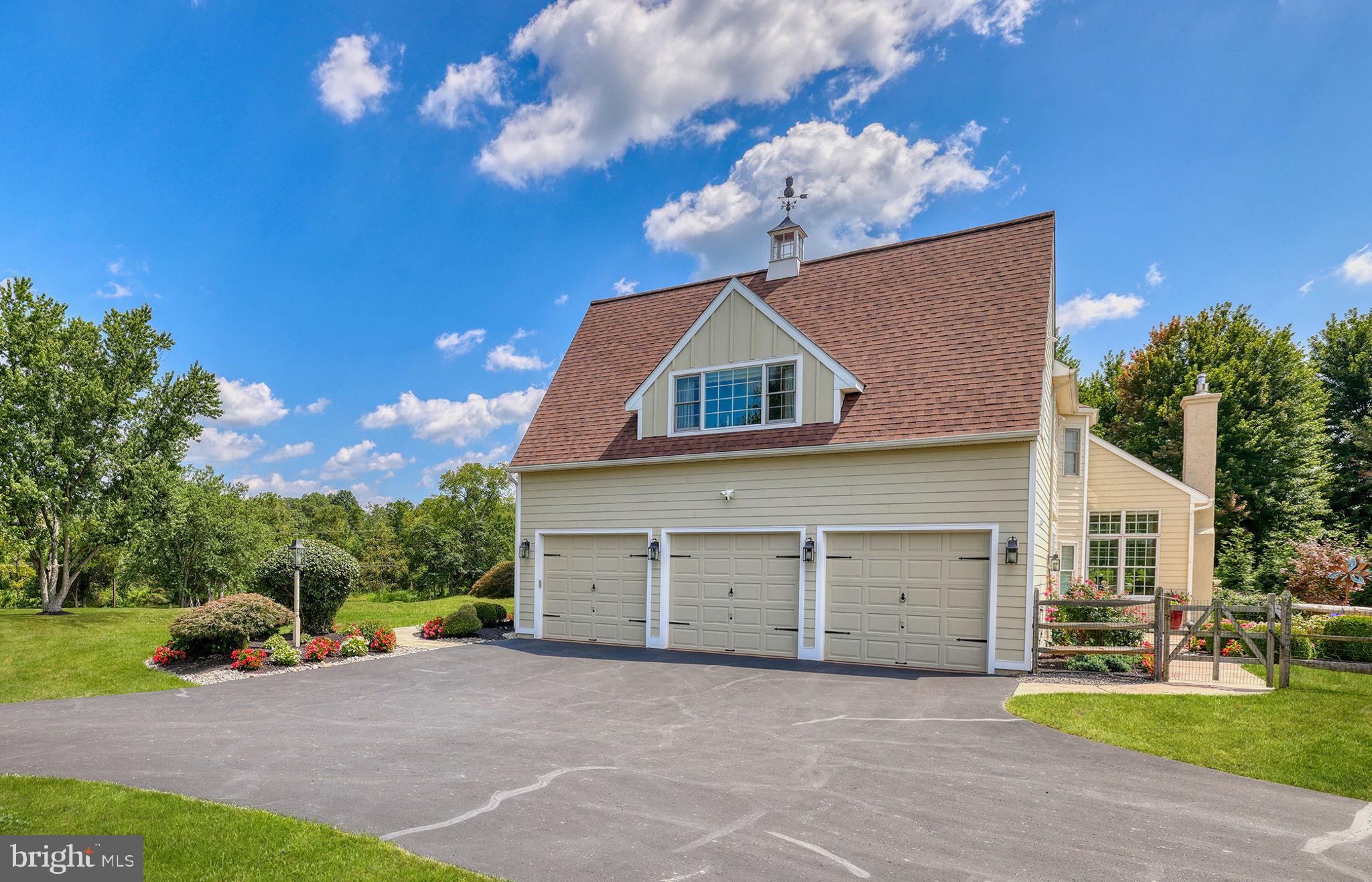1100 Pineville Road New Hope, PA 18938 - Photo 82 of 97 a front view of a house with a yard and garage