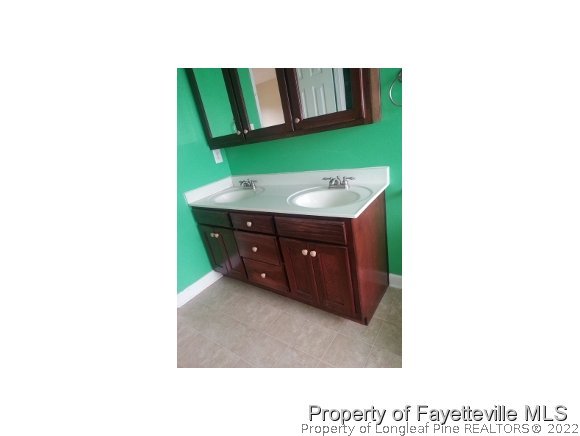 3224 Rozier Siding Road St. Pauls, NC 28384 - Photo 11 of 19 a kitchen with a sink and a mirror