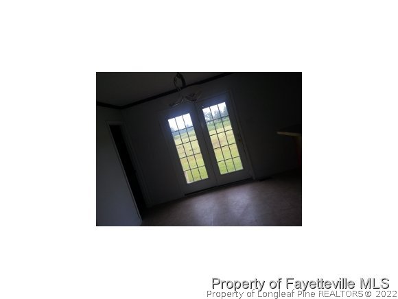 3224 Rozier Siding Road St. Pauls, NC 28384 - Photo 6 of 19 a black and white photo of a living room