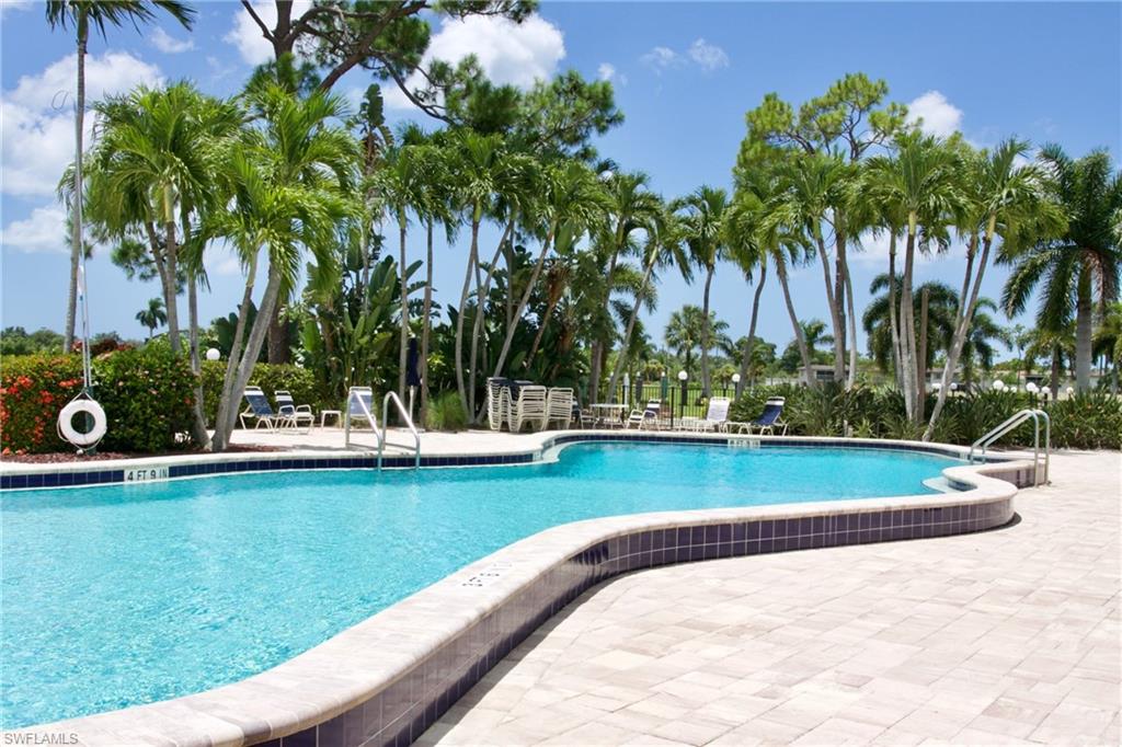 186 Harrison Road, Unit H4 Naples, FL 34112 - Photo 18 of 34 Main community pool with deck and lounging area - get served from the 19th Hole restaurant