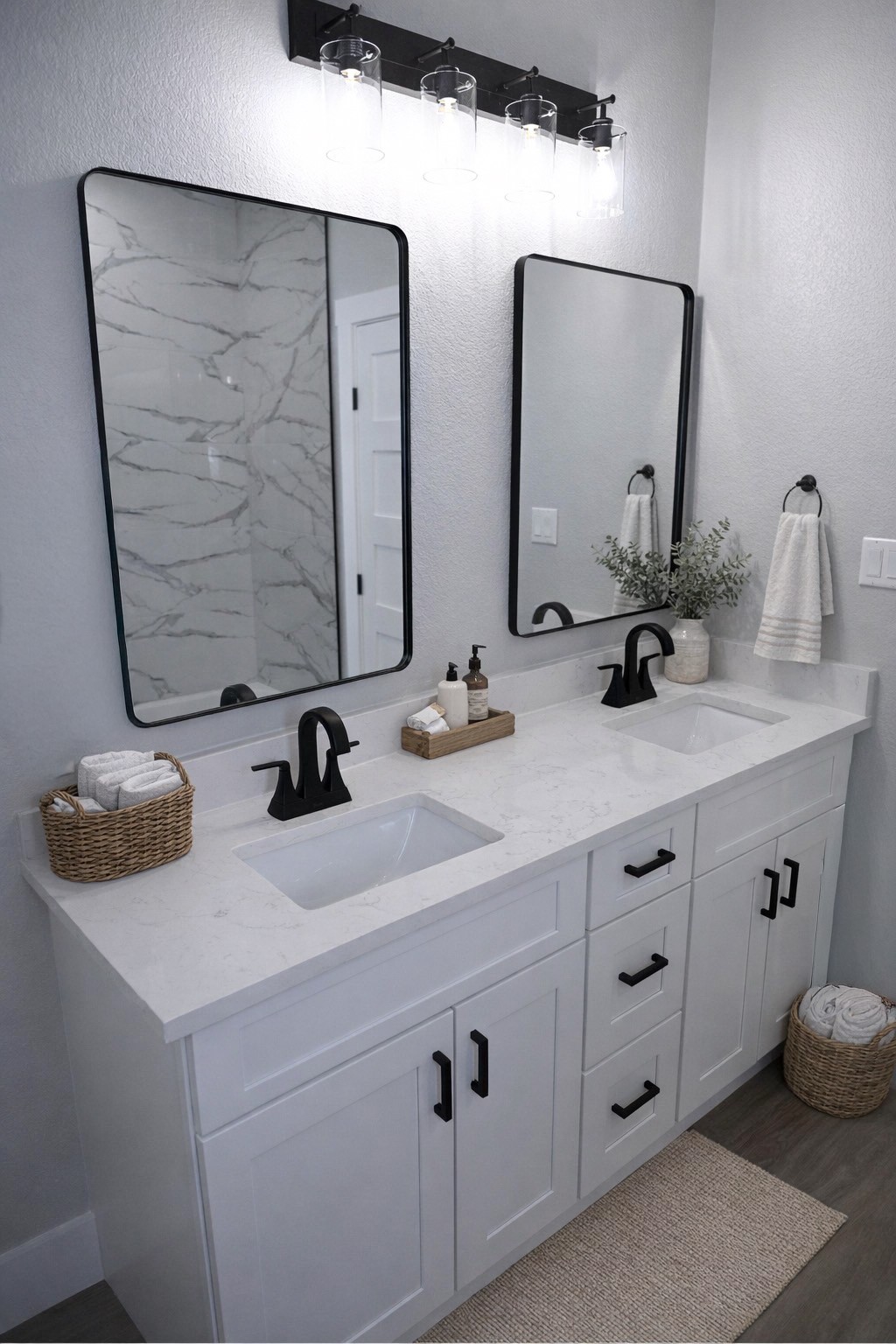 516 North Hackberry Avenue Luling, TX 78648 - Photo 5 of 36 Bathroom with double vanity, a textured wall, and dark wood-style floors